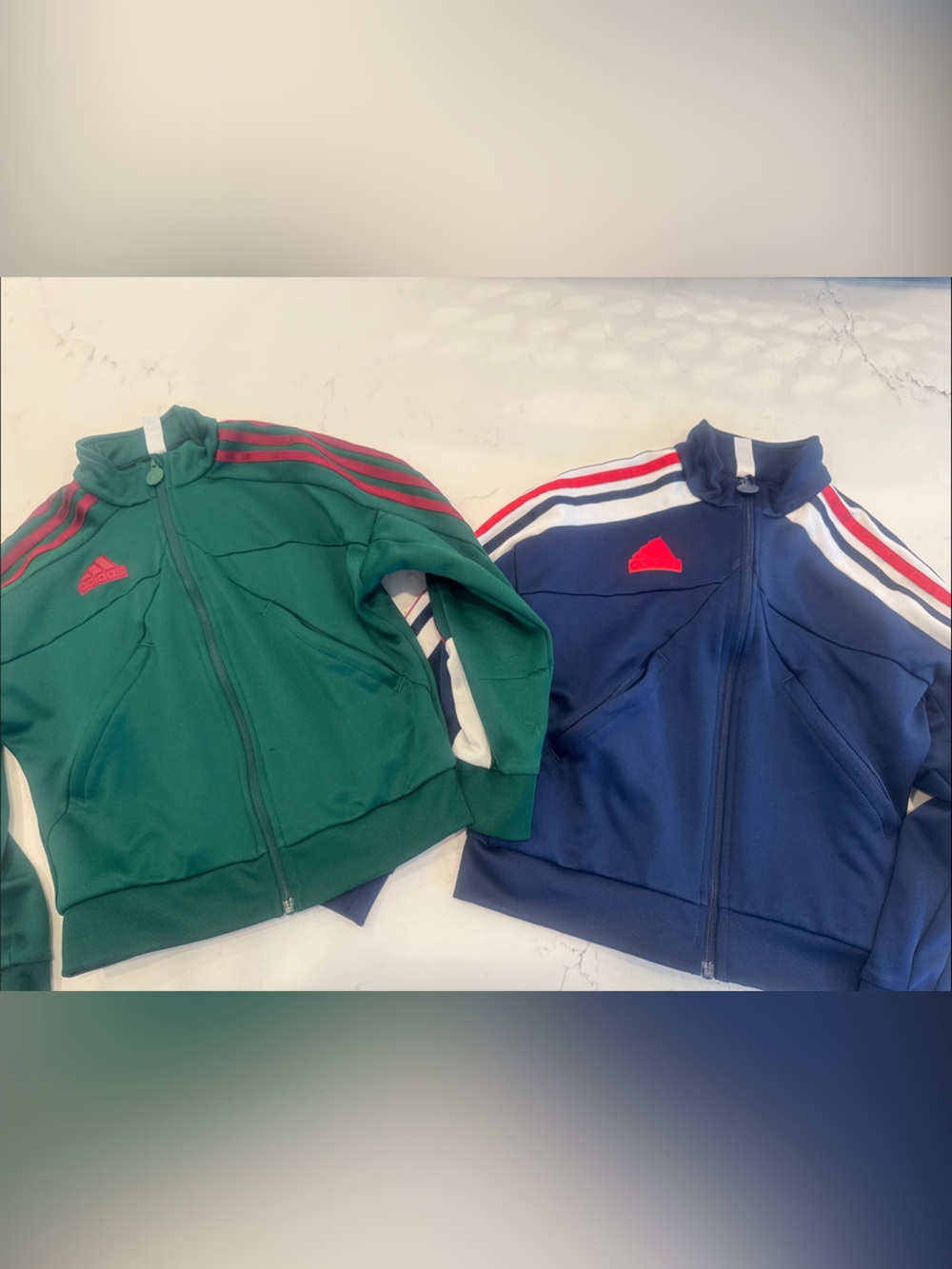 Two zip Adidas track suit tops